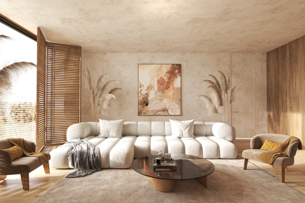 Clean and cozy living room with a cream sofa, neutral decor and natural sunlight creating a relaxing atmosphere.